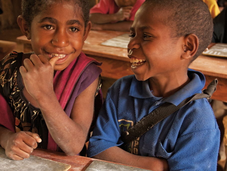 Two children smiling at school in PNG