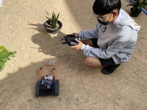 A Thai student controlling a robot